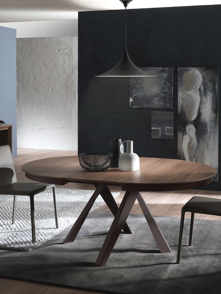 Tavolo rotondo allungabile in Noce Canaletto con base in metallo Emisfero Legno di Ozzio